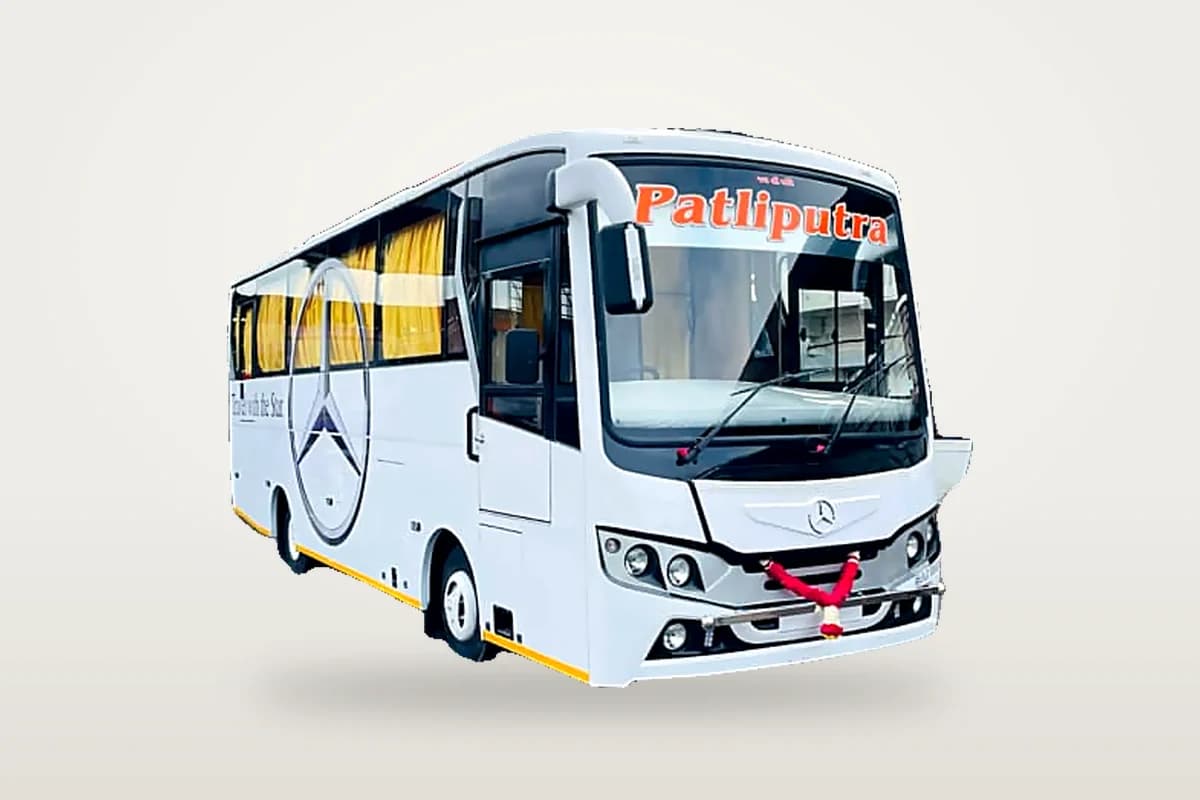 White 28-seat mini coach with yellow curtains